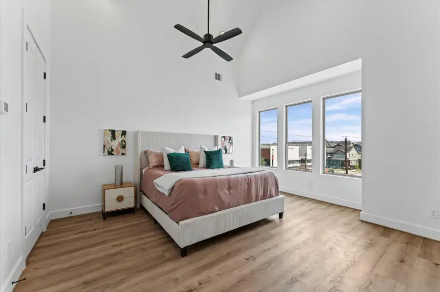 On the third floor, the primary bedroom with space for a sitting area On the third floor, the primary bedroom with space for a sitting area