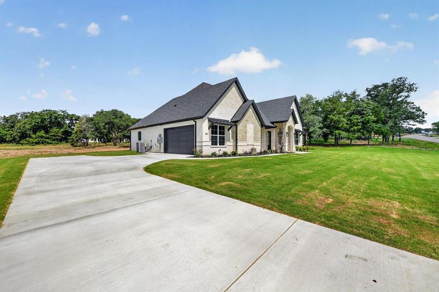 Front exterior of a new home in , Azle, TX, highlighting curb appeal (Image 22). Front exterior of a new home in , Azle, TX, highlighting curb appeal (Image 22).