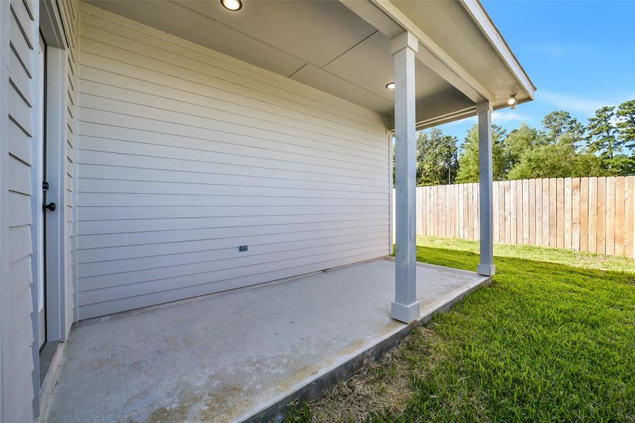 Exterior details and patio area of a home in Mostyn Springs, Magnolia (Image 16).