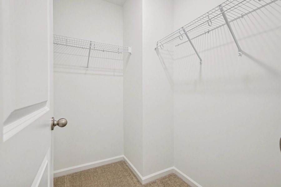 Primary Walk-In featuring the AW Collection® Timeless - Organized luxury with timeless appeal.