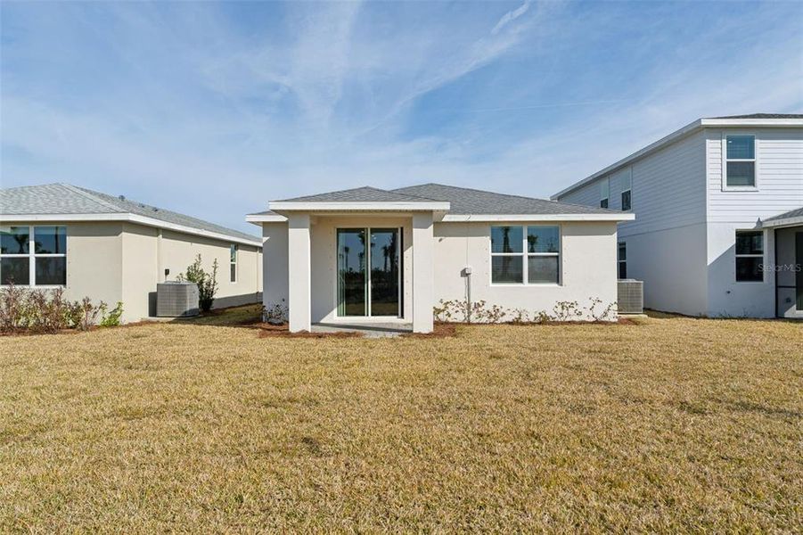 Exterior details and patio area of a home in Crescent Lakes - Premier Series, Punta Gorda (Image 3).