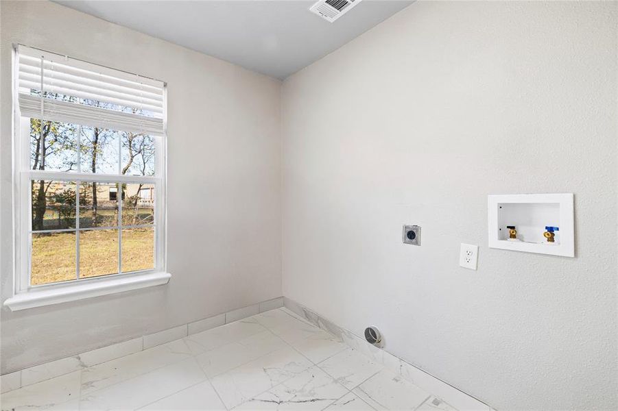 washer and electric dryer hookup in bathroom