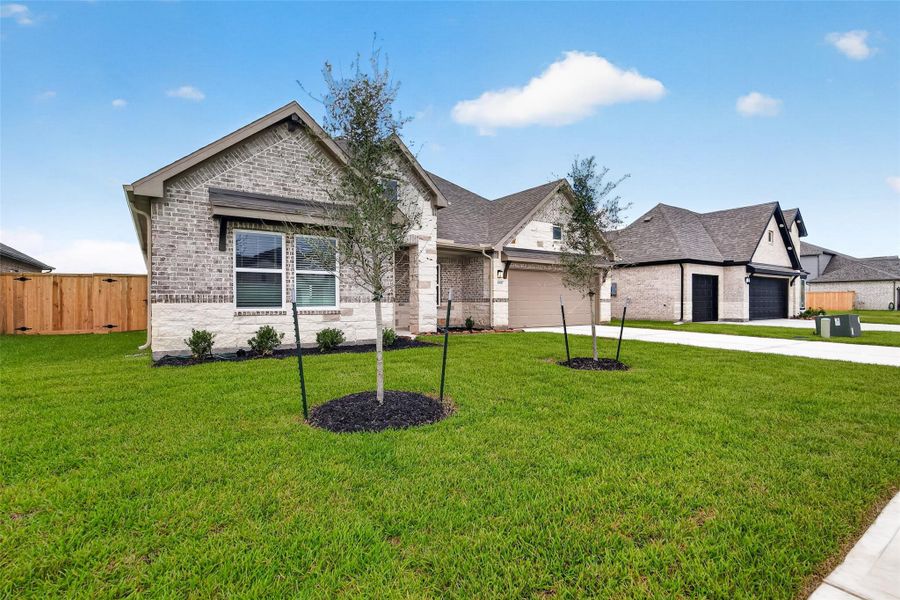 Front exterior of a new home in Foxtail Palms, Manvel, TX, highlighting curb appeal (Image 24).
