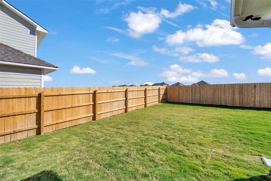 View of fenced backyard