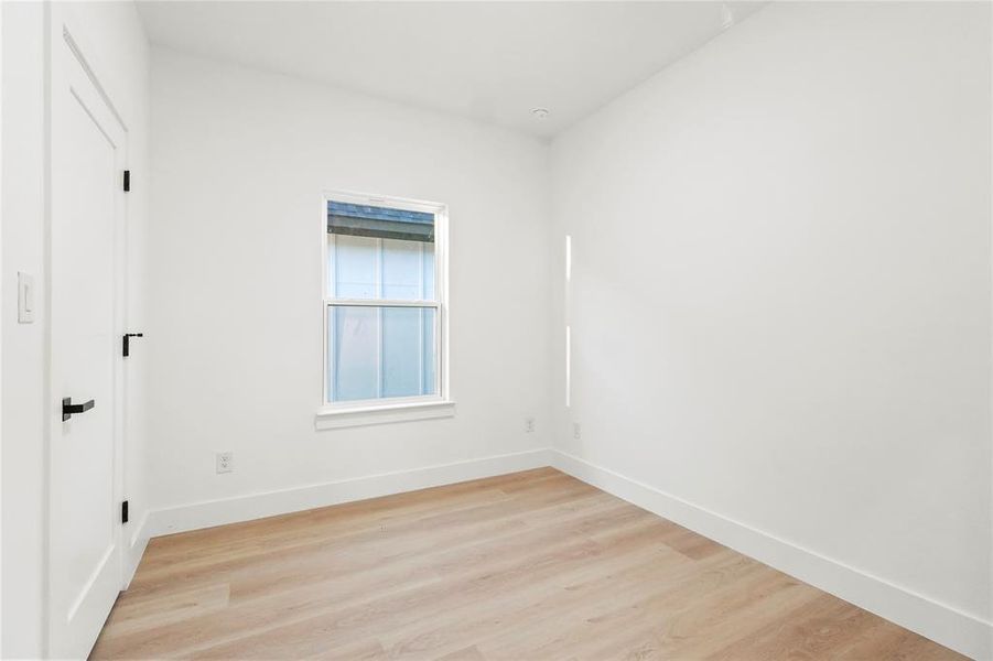 Unfurnished room featuring light wood-style flooring Unfurnished room featuring light wood-style flooring