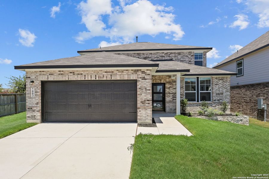 Front exterior of a new home in Comanche Ridge, San Antonio, TX, highlighting curb appeal (Image 41). Front exterior of a new home in Comanche Ridge, San Antonio, TX, highlighting curb appeal (Image 41).