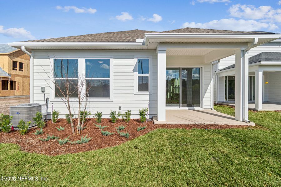 Exterior details and patio area of a home in Evergreen Island at Silverleaf - Executive, St. Augustine (Image 22).