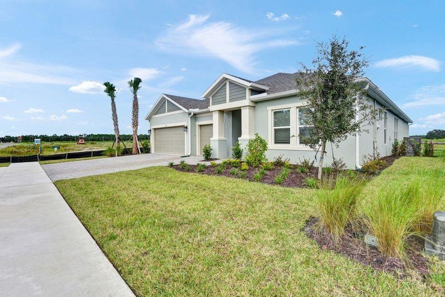 Front exterior of a new home in Ardisia Park, New Smyrna Beach, FL, highlighting curb appeal (Image 2).