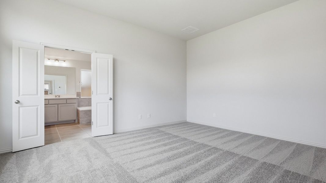 Furnished interior view inside a new home in Green Meadows Premier, Celina (Image 28).