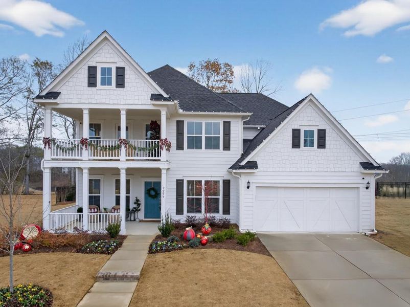 Front exterior of a new home in Reunion, Flowery Branch, GA, highlighting curb appeal (Image 22). Front exterior of a new home in Reunion, Flowery Branch, GA, highlighting curb appeal (Image 22).