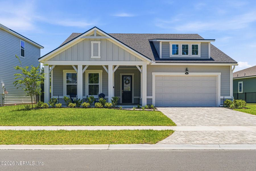 Front exterior of a new home in RiverTown, St. Johns, FL, highlighting curb appeal (Image 25).