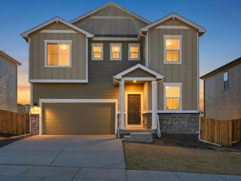 Front exterior of a new home in Lorson Ranch : The Springs Collection, Colorado Springs, CO, highlighting curb appeal (Image 1). Front exterior of a new home in Lorson Ranch : The Springs Collection, Colorado Springs, CO, highlighting curb appeal (Image 1).
