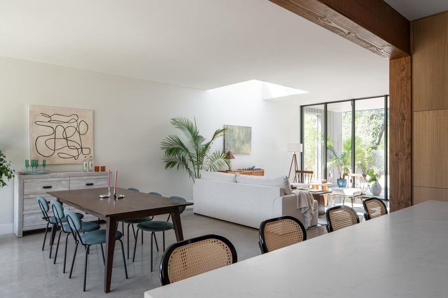 Dining room with a skylight and floor to ceiling windows