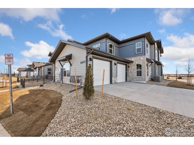 Front exterior of a new home in Wilder at Timnath Ranch, Timnath, CO, highlighting curb appeal (Image 2).