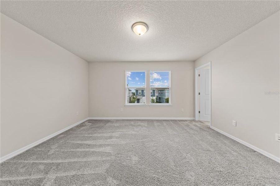 Spacious, unfurnished interior of a new home in EverBe, Orlando (Image 40).