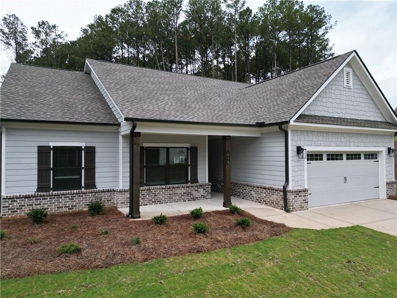 Front exterior of a new home in Red Oak Ridge, Loganville, GA, highlighting curb appeal (Image 2). Front exterior of a new home in Red Oak Ridge, Loganville, GA, highlighting curb appeal (Image 2).