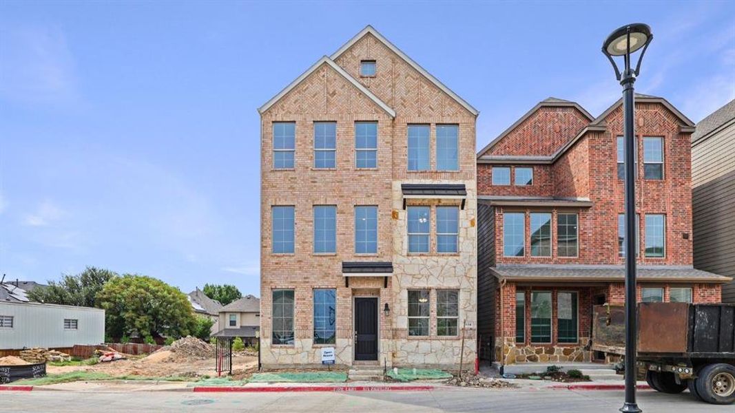Front exterior of a new home in Mustang Square, Plano, TX, highlighting curb appeal (Image 1). Front exterior of a new home in Mustang Square, Plano, TX, highlighting curb appeal (Image 1).