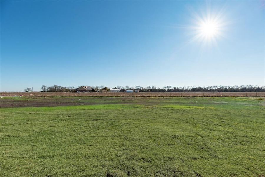 View of green lawn with a view of countryside View of green lawn with a view of countryside