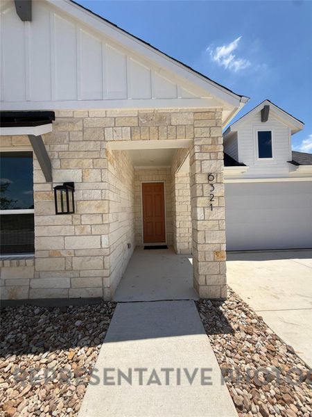 Exterior details and patio area of a home in Goodnight Ranch, Austin (Image 3). Exterior details and patio area of a home in Goodnight Ranch, Austin (Image 3).