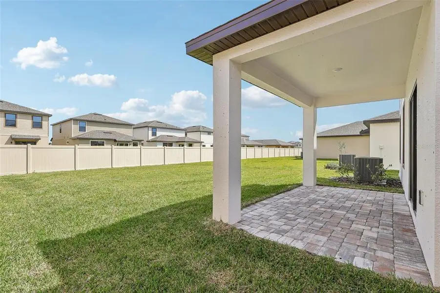 Exterior details and patio area of a home in Grasslands West, Lakeland (Image 3).