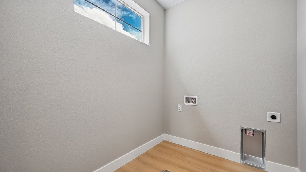 Natural light brightens this thoughtfully designed laundry room