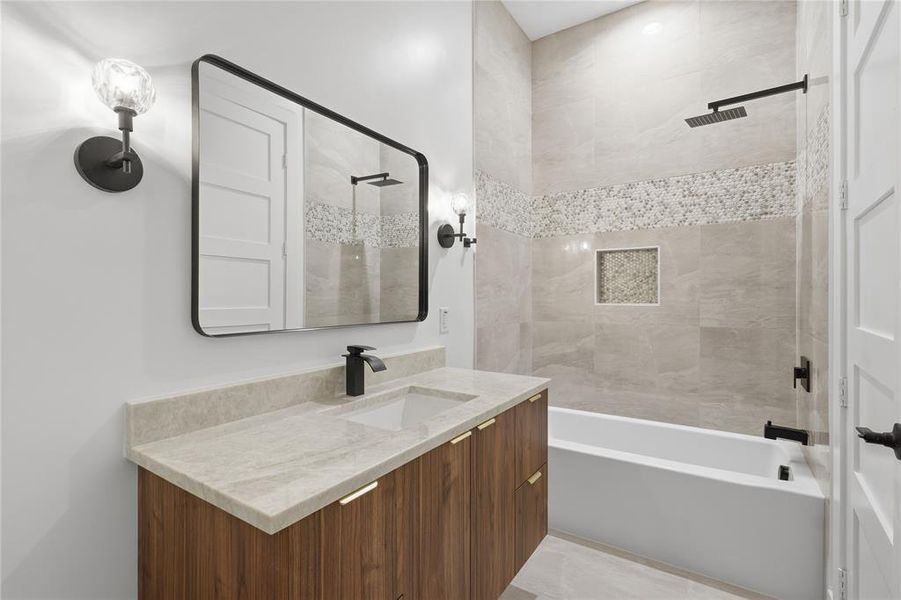 Full bathroom featuring vanity and shower / washtub combination Full bathroom featuring vanity and shower / washtub combination