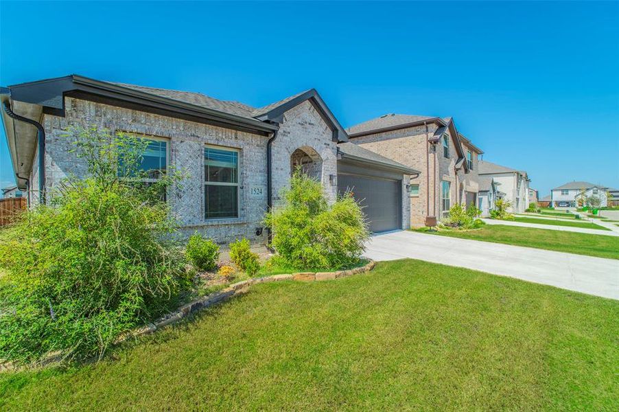 Front exterior of a new home in , Aubrey, TX, highlighting curb appeal (Image 25).