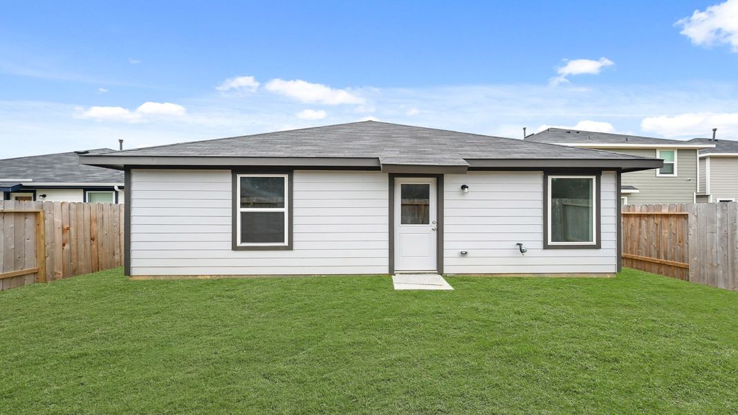 Exterior details and patio area of a home in The Canopies, Splendora (Image 16).