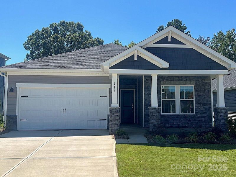 Front exterior of a new home in Oxford Station, Salisbury, NC, highlighting curb appeal (Image 1).