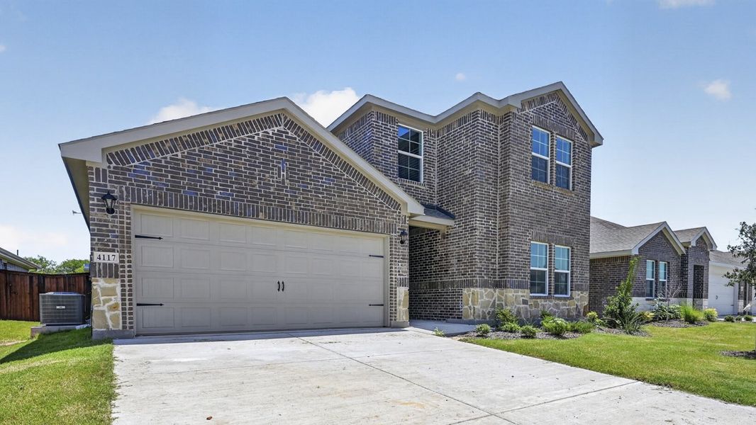 Front exterior of a new home in Sanger Circle, Sanger, TX, highlighting curb appeal (Image 2). Front exterior of a new home in Sanger Circle, Sanger, TX, highlighting curb appeal (Image 2).