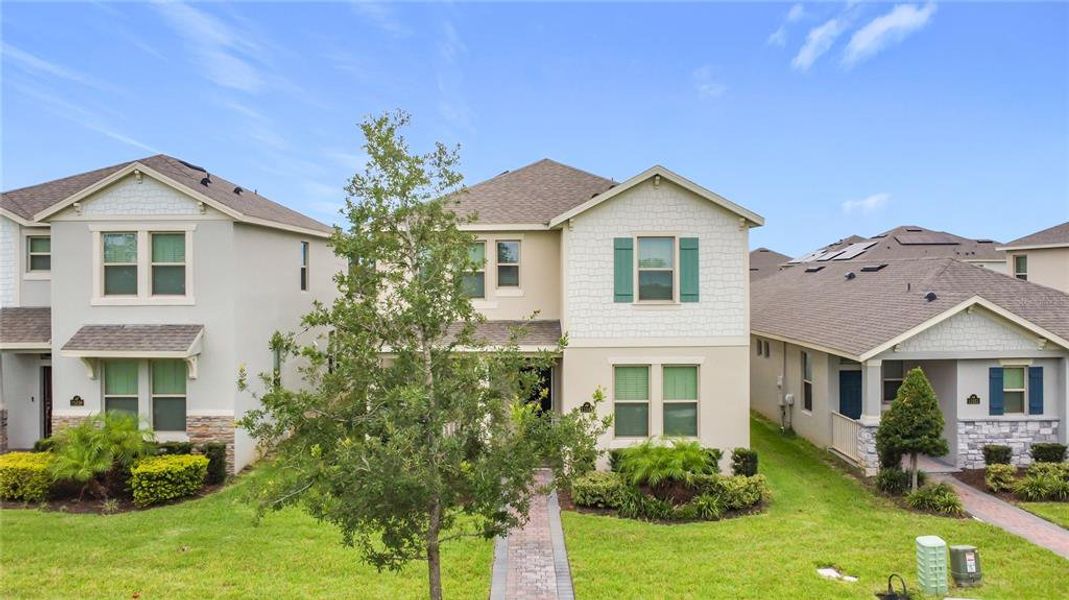 Front exterior of a new home in , Winter Garden, FL, highlighting curb appeal (Image 29).