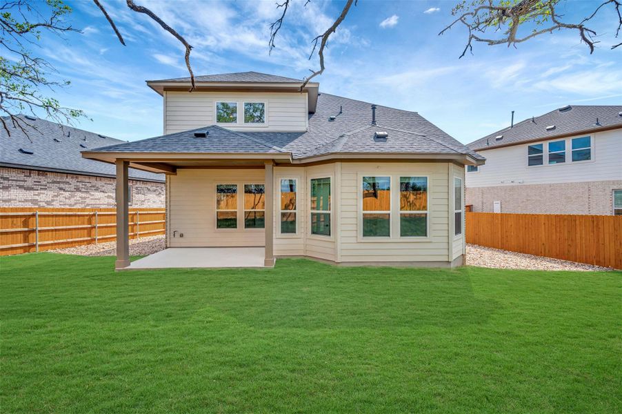 Exterior details and patio area of a home in Heritage, Dripping Springs (Image 14).