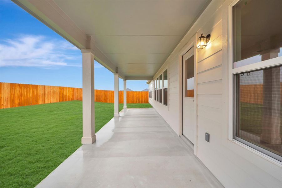 Exterior details and patio area of a home in Carillon, Manor (Image 12).