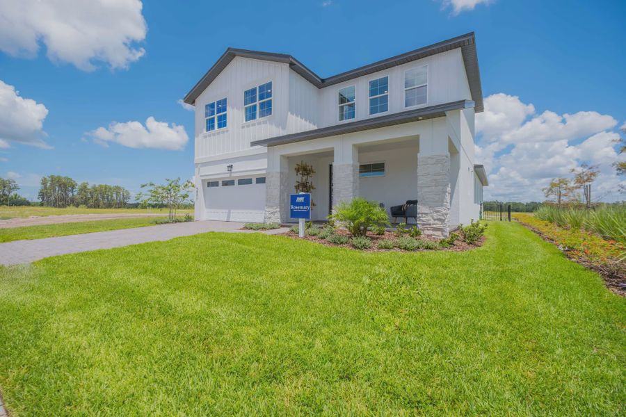 Representative exterior photo of a completed home built from the Rosemary by Jones Homes USA in Havenfield at Crossprairie, St. Cloud, FL (Image 9).