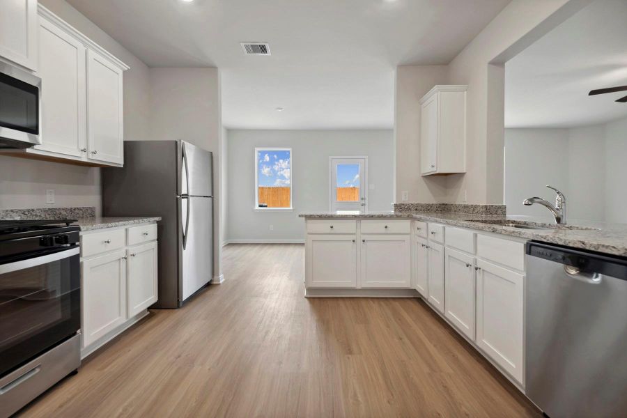 Whirlpool kitchen appliances and granite countertops make this kitchen chef-ready! Whirlpool kitchen appliances and granite countertops make this kitchen chef-ready!