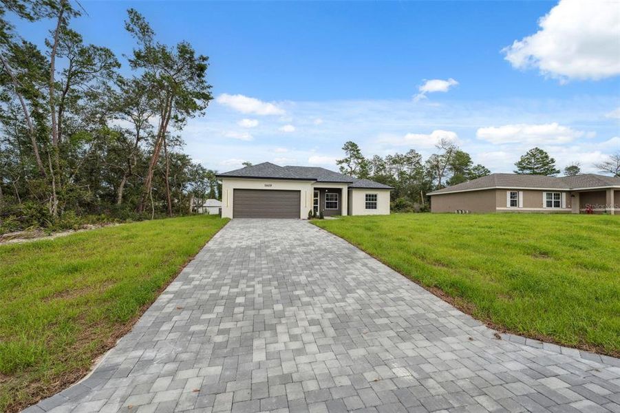 Front exterior of a new home in , Ocala, FL, highlighting curb appeal (Image 25).