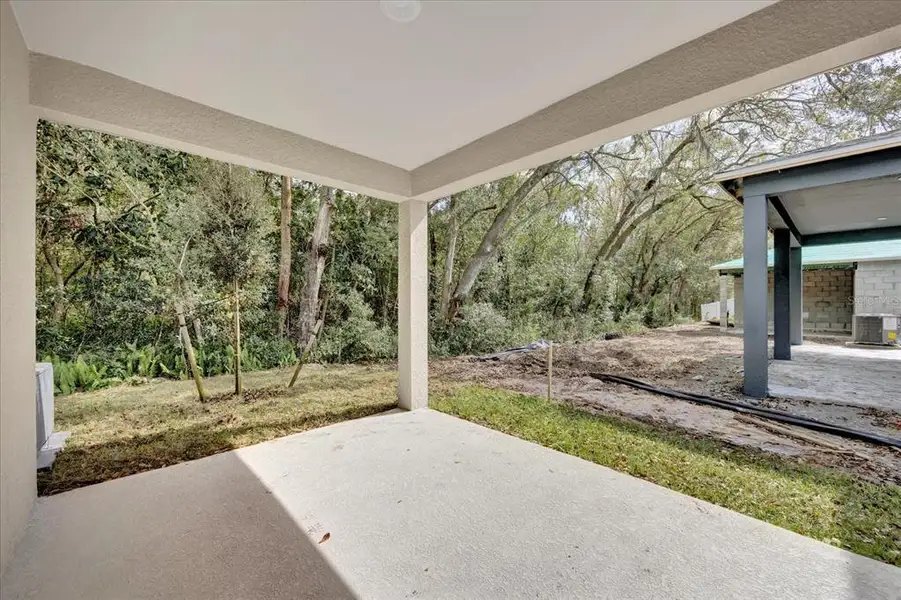 Exterior details and patio area of a home in Wilder Pines, Lakeland (Image 4). Exterior details and patio area of a home in Wilder Pines, Lakeland (Image 4).