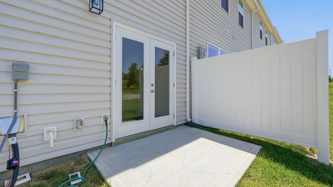 Exterior details and patio area of a home in The Arbor Townhomes, Kingsport (Image 19).