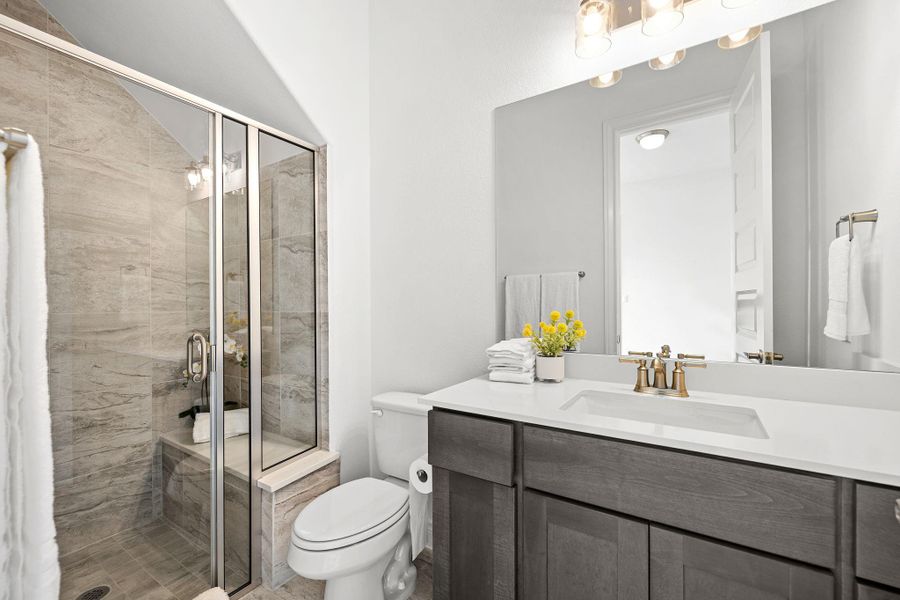 Full bathroom featuring vanity and a shower stall