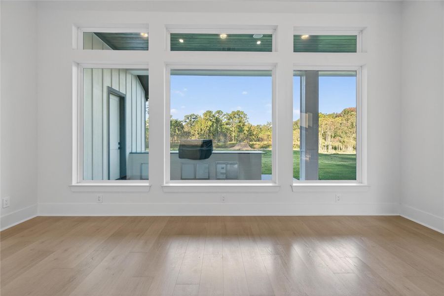 Large windows provide peaceful outdoor views and bring abundant natural light into the home. **Images are from a previously completed project. **