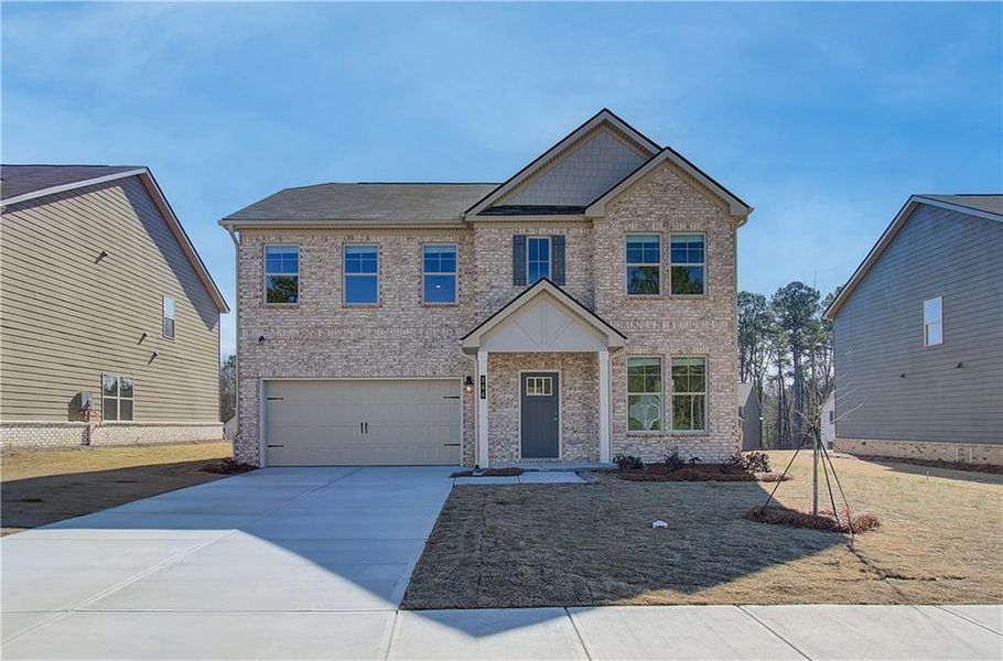 Front exterior of a new home in Cedar Grove Commons, Conley, GA, highlighting curb appeal (Image 15). Front exterior of a new home in Cedar Grove Commons, Conley, GA, highlighting curb appeal (Image 15).