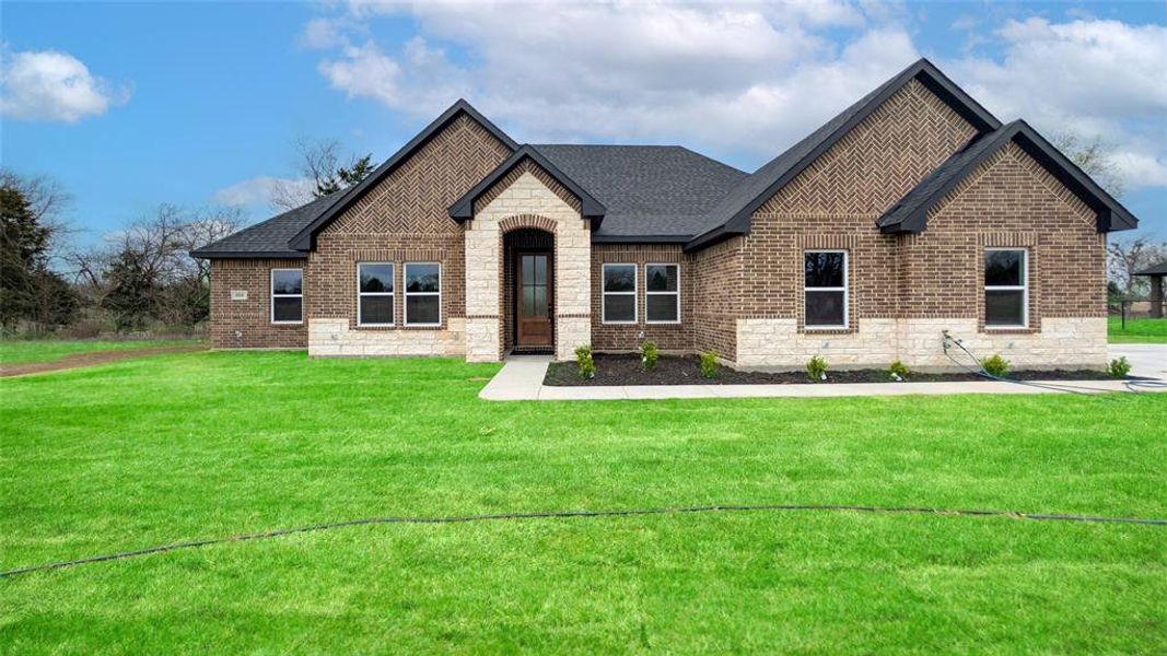 Front exterior of a new home in , Greenville, TX, highlighting curb appeal (Image 22).