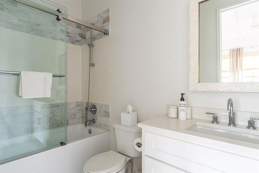 Bedroom with concrete floors, multiple windows, and beam ceiling Bedroom with concrete floors, multiple windows, and beam ceiling