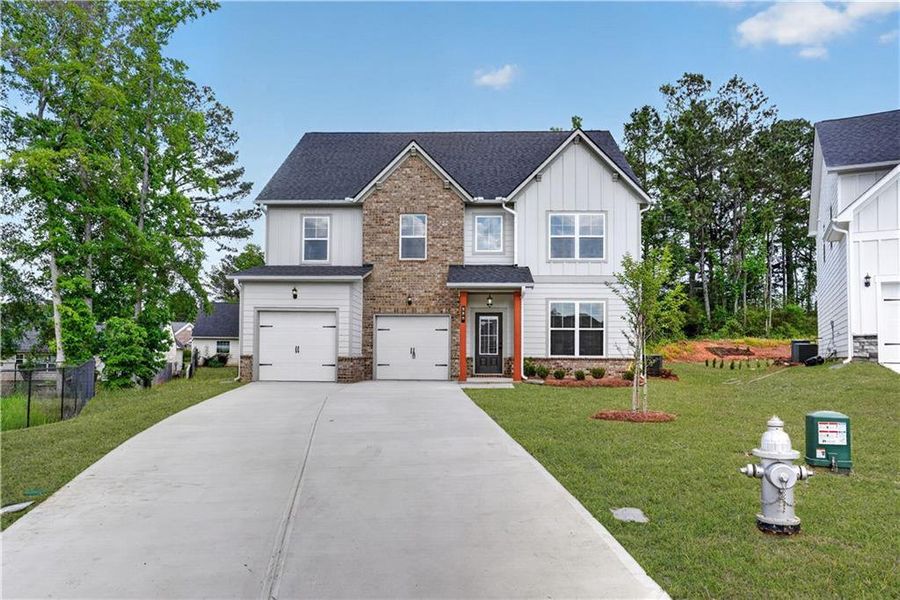 Front exterior of a new home in , Villa Rica, GA, highlighting curb appeal (Image 1). Front exterior of a new home in , Villa Rica, GA, highlighting curb appeal (Image 1).