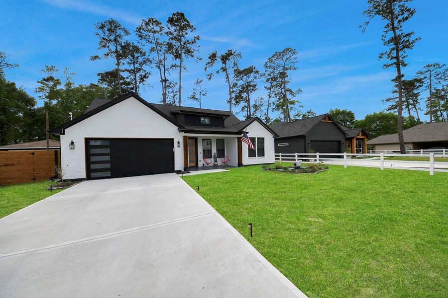 Front exterior of a new home in , Spring, TX, highlighting curb appeal (Image 2).