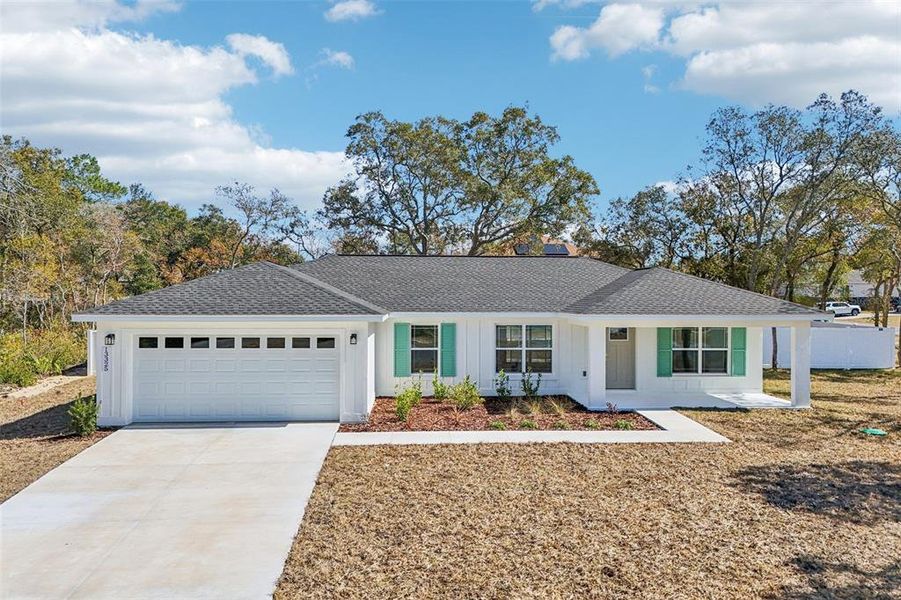 Front exterior of a new home in , Ocala, FL, highlighting curb appeal (Image 2). Front exterior of a new home in , Ocala, FL, highlighting curb appeal (Image 2).