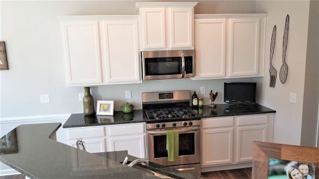 Representative furnished interior of a home built from the Emory by Piedmont Residential in Falls Creek, Flowery Branch (Image 17).