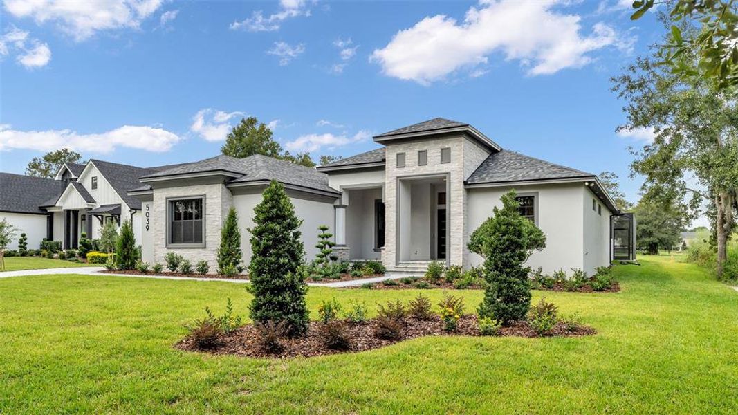 Front exterior of a new home in , Lakeland, FL, highlighting curb appeal (Image 2). Front exterior of a new home in , Lakeland, FL, highlighting curb appeal (Image 2).