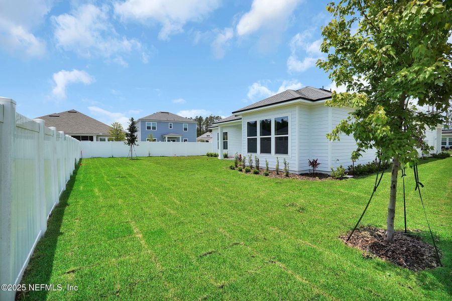 Exterior details and patio area of a home in Forest Park at Wildlight, Yulee (Image 28).