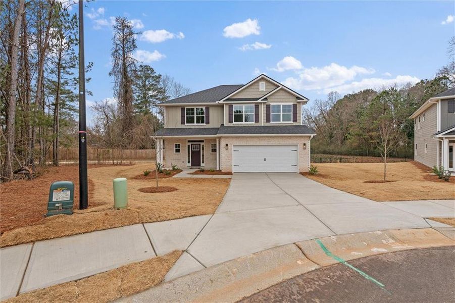 Front exterior of a new home in Canterbury Villas, Carrollton, GA, highlighting curb appeal (Image 21).